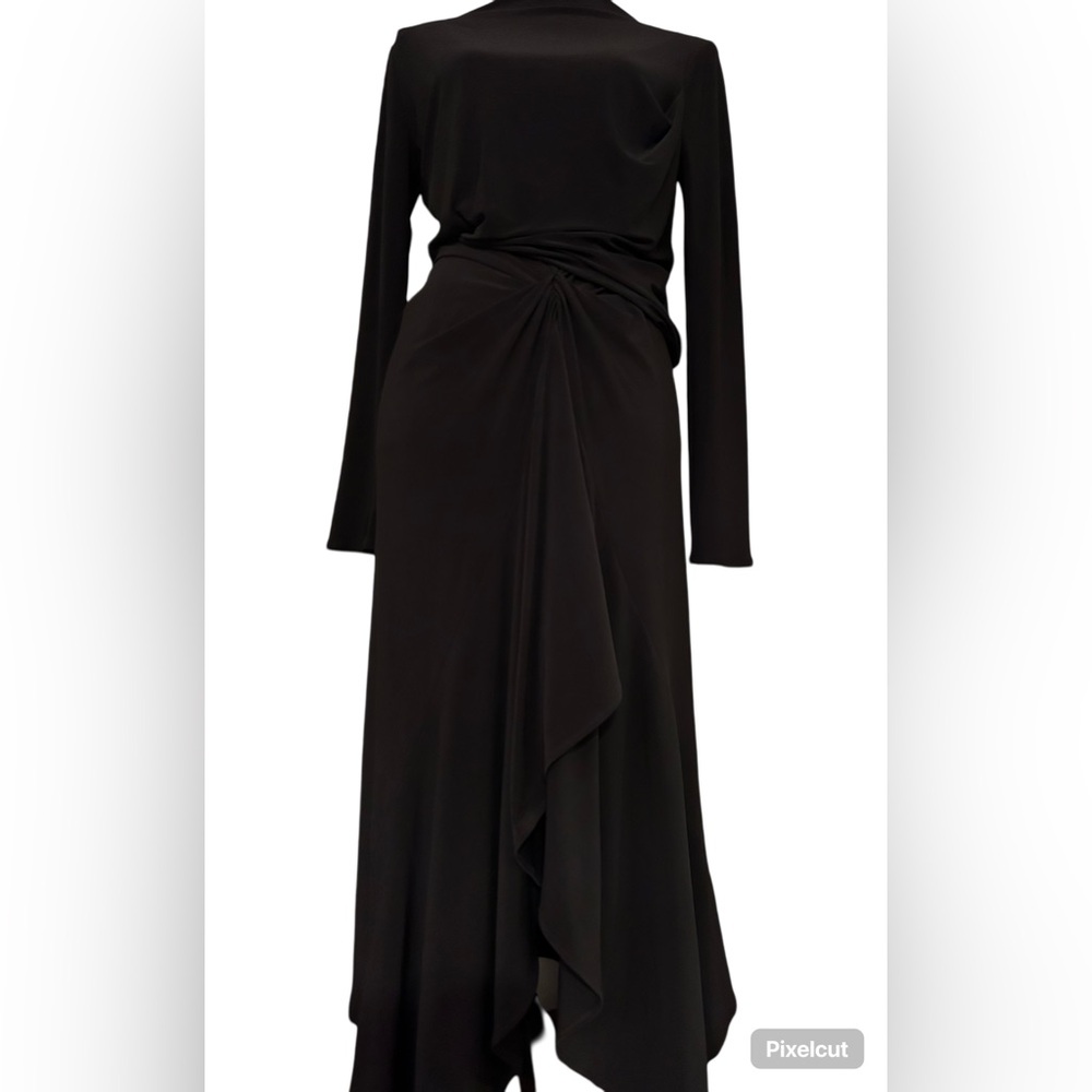 The Zara black dress in size small features a soft, flowy silhouette.